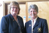Outgoing Lady Captain Paula McCrory congratulates new Lady Captain Hilary Johnston